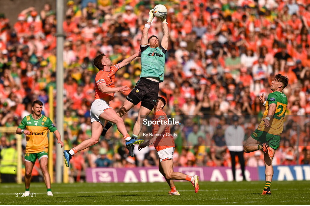10 May 2025; Donegal goalkeeper Shaun Patton in action against Ross McQuillan of Armagh during the Ulster GAA Football Senior Championship final match between Armagh and Donegal at St Tiernach's Park in Clones, Monaghan. Photo by Ramsey Cardy/Sportsfile