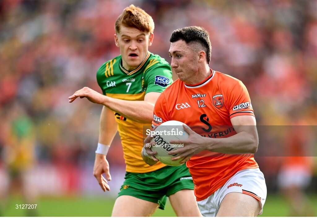 10 May 2025; Oisin Conaty of Armagh in action against Ciaran Moore of Donegal during the Ulster GAA Football Senior Championship final match between Armagh and Donegal at St Tiernach's Park in Clones, Monaghan. Photo by David Fitzgerald/Sportsfile