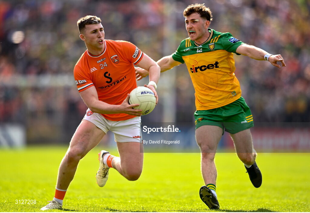 10 May 2025; Tiernan Kelly of Armagh in action against Shane O'Donnell of Donegal during the Ulster GAA Football Senior Championship final match between Armagh and Donegal at St Tiernach's Park in Clones, Monaghan. Photo by David Fitzgerald/Sportsfile