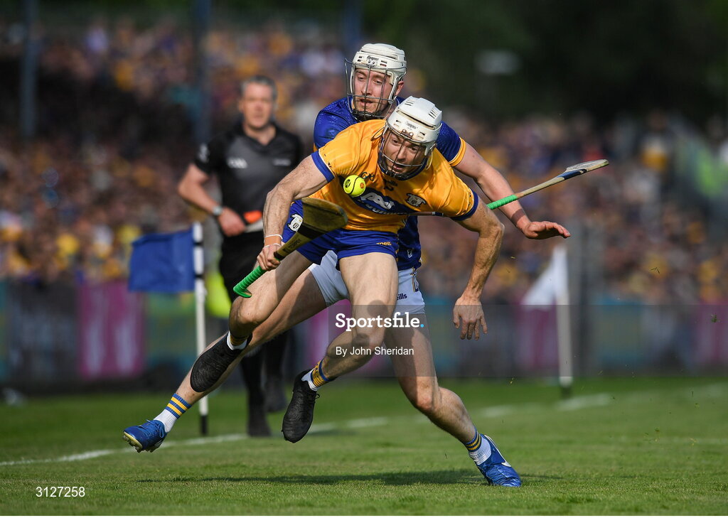 10 May 2025; Ryan Taylor of Clare is tackled by Eoghan Connolly of Tipperary during the Munster GAA Hurling Senior Championship Round 3 match between Clare and Tipperary at Zimmer Biomet Páirc Chíosóg in Ennis, Clare. Photo by John Sheridan/Sportsfile
