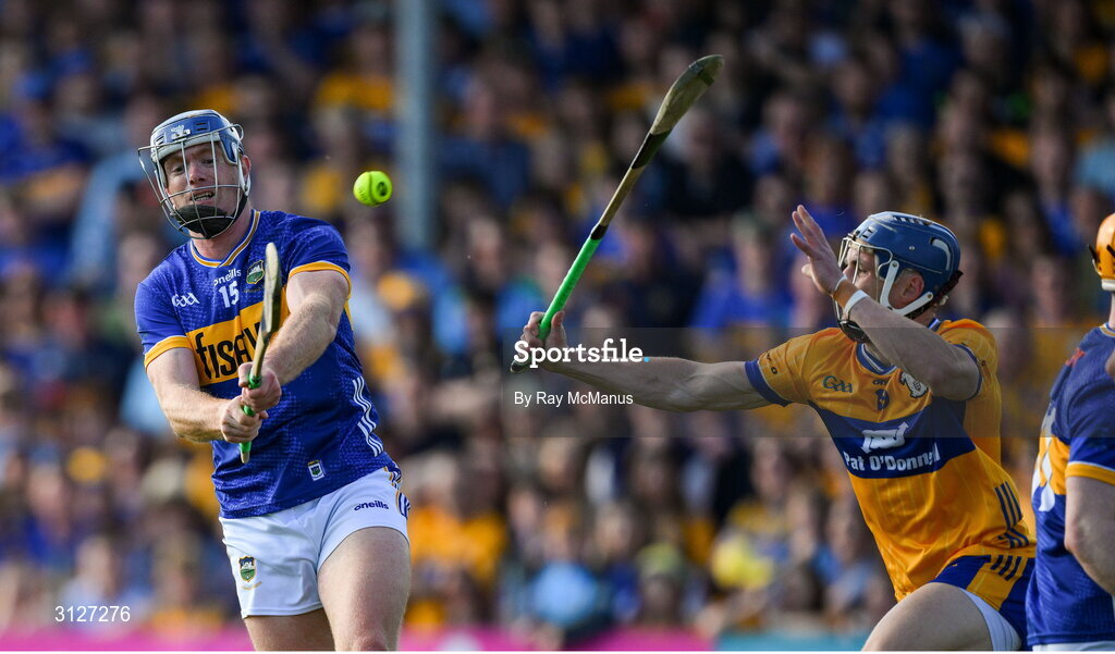 10 May 2025; Jason Forde of Tipperary scores a point under pressure from Rory Hayes of Clare during the Munster GAA Hurling Senior Championship Round 3 match between Clare and Tipperary at Zimmer Biomet Páirc Chíosóg in Ennis, Clare. Photo by Ray McManus/Sportsfile
