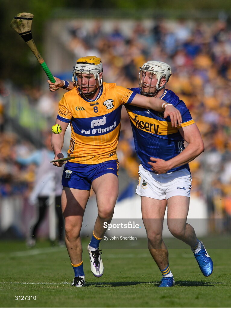 10 May 2025; Sean Rynne of Clare in action against Eoghan Connolly of Tipperary during the Munster GAA Hurling Senior Championship Round 3 match between Clare and Tipperary at Zimmer Biomet Páirc Chíosóg in Ennis, Clare. Photo by John Sheridan/Sportsfile