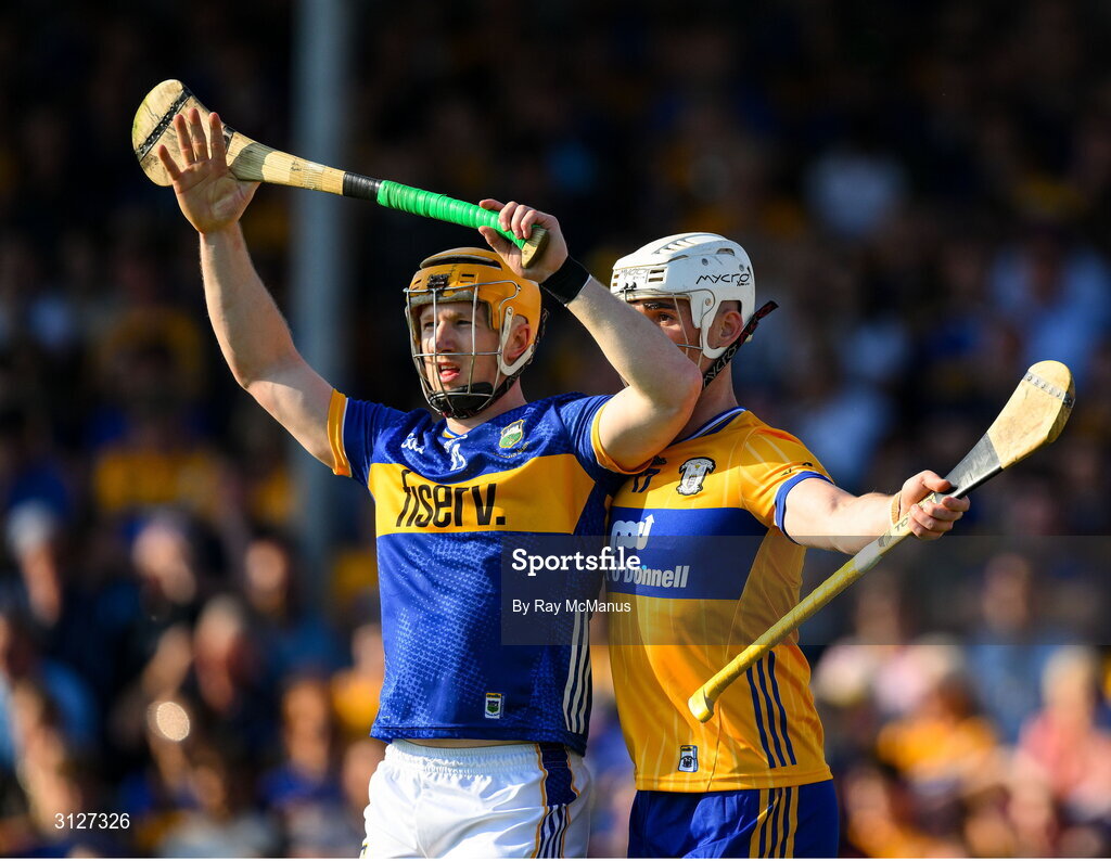 10 May 2025; Jake Morris of Tipperary is marked closly by Daithi Lohan of Clare during the Munster GAA Hurling Senior Championship Round 3 match between Clare and Tipperary at Zimmer Biomet Páirc Chíosóg in Ennis, Clare. Photo by Ray McManus/Sportsfile
