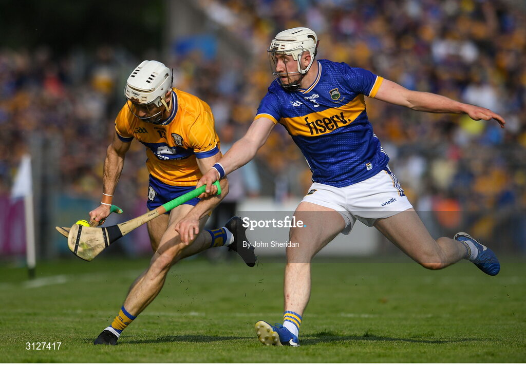 10 May 2025; Ryan Taylor of Clare is tackled by Eoghan Connolly of Tipperary during the Munster GAA Hurling Senior Championship Round 3 match between Clare and Tipperary at Zimmer Biomet Páirc Chíosóg in Ennis, Clare. Photo by John Sheridan/Sportsfile