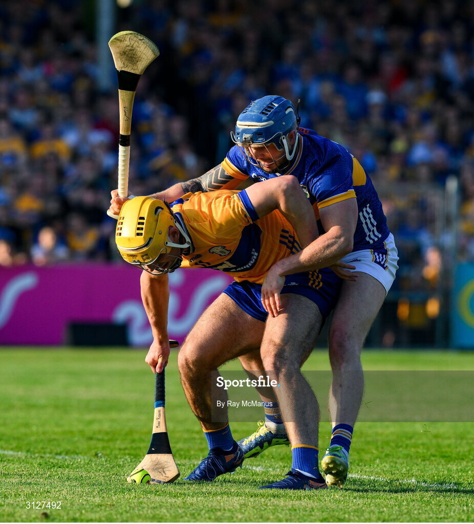 10 May 2025; Mark Rodgers of Clare is tackled by Willie Connors of Tipperary during the Munster GAA Hurling Senior Championship Round 3 match between Clare and Tipperary at Zimmer Biomet Páirc Chíosóg in Ennis, Clare. Photo by Ray McManus/Sportsfile