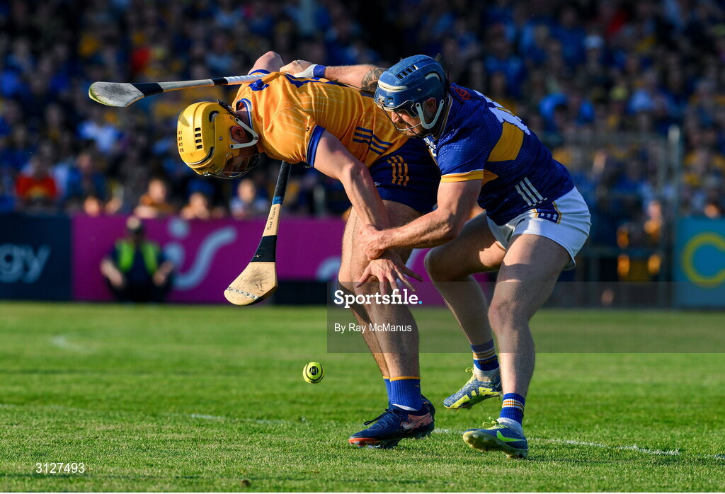 10 May 2025; Mark Rodgers of Clare is tackled by Willie Connors of Tipperary during the Munster GAA Hurling Senior Championship Round 3 match between Clare and Tipperary at Zimmer Biomet Páirc Chíosóg in Ennis, Clare. Photo by Ray McManus/Sportsfile