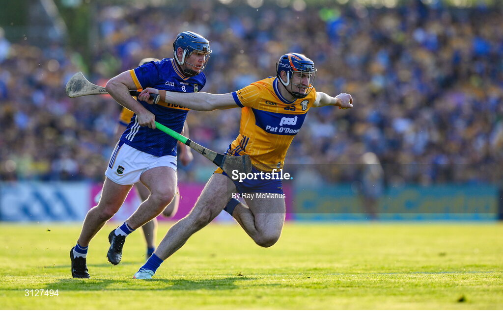 10 May 2025; David Fitzgerald of Clare is tackled by Alan Tynan of Tipperary during the Munster GAA Hurling Senior Championship Round 3 match between Clare and Tipperary at Zimmer Biomet Páirc Chíosóg in Ennis, Clare. Photo by Ray McManus/Sportsfile