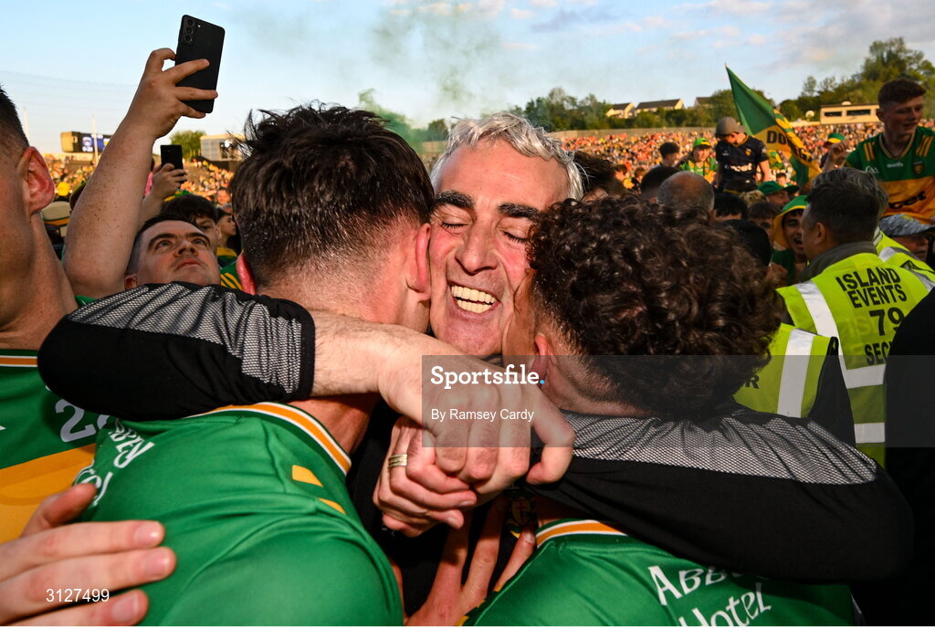 10 May 2025; Donegal manager Jim McGuinness celebrates with Michael Langan, left, and Odhran McFadden Ferry, after the Ulster GAA Football Senior Championship final match between Armagh and Donegal at St Tiernach's Park in Clones, Monaghan. Photo by Ramsey Cardy/Sportsfile