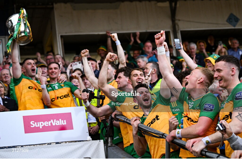 10 May 2025; Ryan McHugh of Donegal, centre, as teammate Patrick McBrearty lifts the Anglo-Celt Cup during the Ulster GAA Football Senior Championship final match between Armagh and Donegal at St Tiernach's Park in Clones, Monaghan. Photo by Ramsey Cardy/Sportsfile