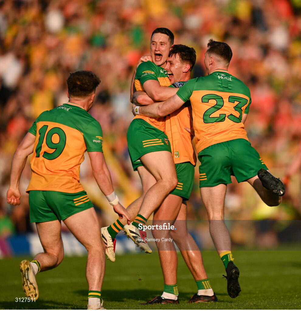 10 May 2025; Donegal players, from left, Odhran Doherty, Eoin McHugh, Michael Langan and Jamie Brennan celebrate at the final whistle of the Ulster GAA Football Senior Championship final match between Armagh and Donegal at St Tiernach's Park in Clones, Monaghan. Photo by Ramsey Cardy/Sportsfile