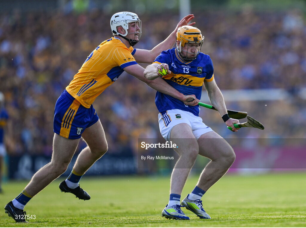 10 May 2025; Jake Morris of Tipperary is tackled by Cian Galvin of Clare during the Munster GAA Hurling Senior Championship Round 3 match between Clare and Tipperary at Zimmer Biomet Páirc Chíosóg in Ennis, Clare. Photo by Ray McManus/Sportsfile