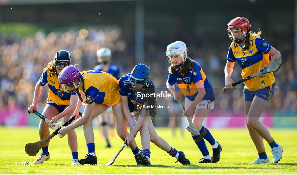 10 May 2025; Girls from schools in both Clare and Tipperary play a game of camogie during the Munster GAA Hurling Senior Championship Round 3 match between Clare and Tipperary at Zimmer Biomet Páirc Chíosóg in Ennis, Clare. Photo by Ray McManus/Sportsfile
