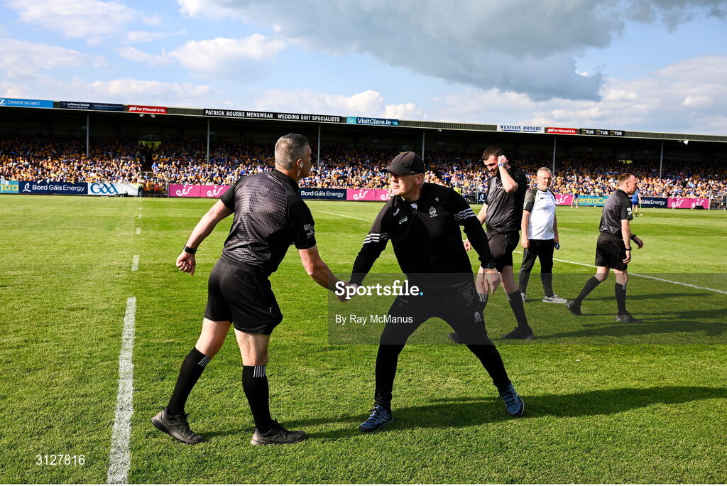 10 May 2025; Clare manager Brian Lohan shakes hands with referee James Owens before the Munster GAA Hurling Senior Championship Round 3 match between Clare and Tipperary at Zimmer Biomet Páirc Chíosóg in Ennis, Clare. Photo by Ray McManus/Sportsfile