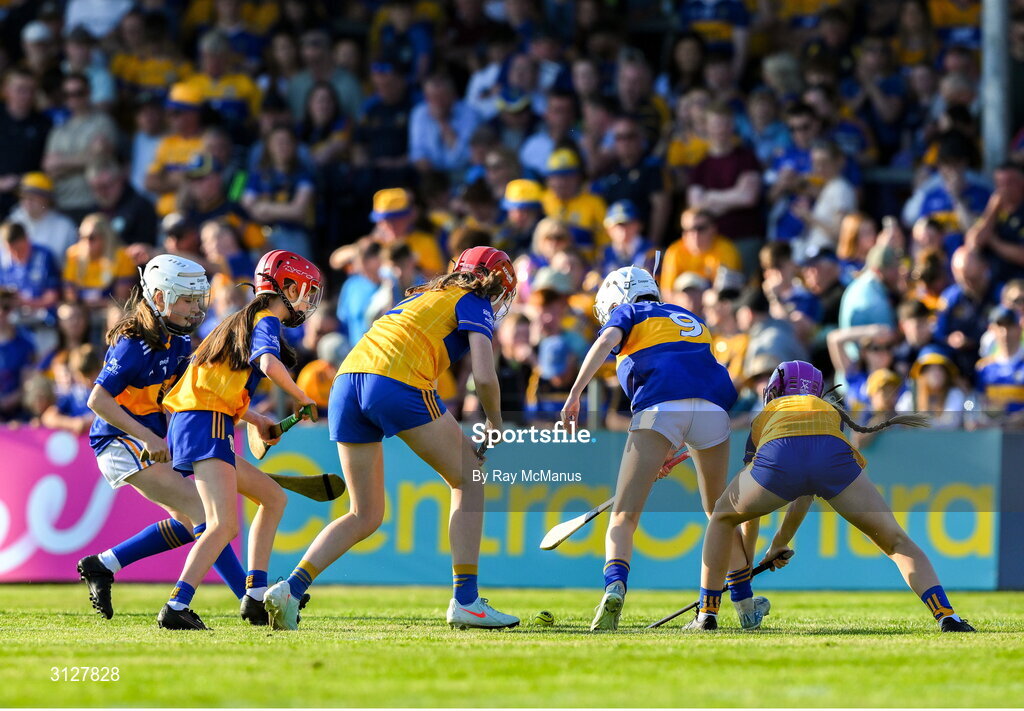 10 May 2025; Girls from schools in both Clare and Tipperary play a game of camogie during the Munster GAA Hurling Senior Championship Round 3 match between Clare and Tipperary at Zimmer Biomet Páirc Chíosóg in Ennis, Clare. Photo by Ray McManus/Sportsfile