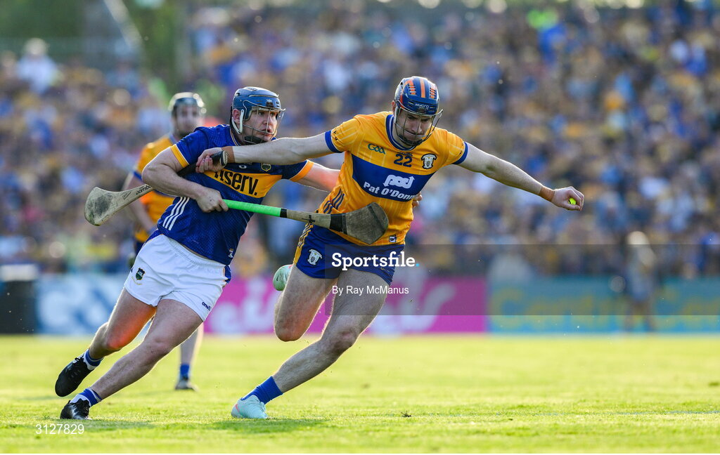 10 May 2025; David Fitzgerald of Clare is tackled by Alan Tynan of Tipperary during the Munster GAA Hurling Senior Championship Round 3 match between Clare and Tipperary at Zimmer Biomet Páirc Chíosóg in Ennis, Clare. Photo by Ray McManus/Sportsfile