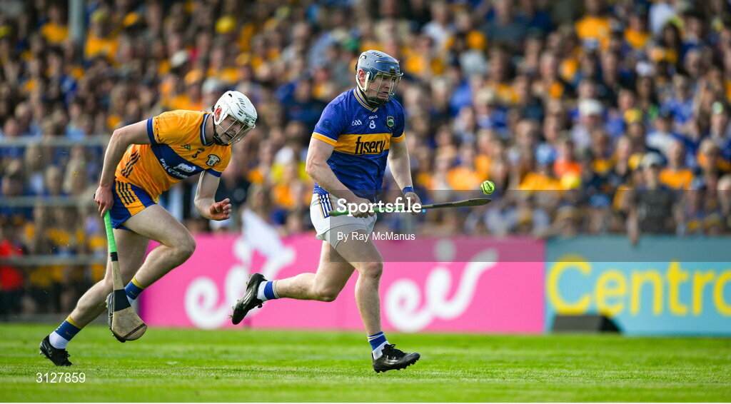 10 May 2025; Alan Tynan of Tipperary races clear of Cian Galvin of Clare during the Munster GAA Hurling Senior Championship Round 3 match between Clare and Tipperary at Zimmer Biomet Páirc Chíosóg in Ennis, Clare. Photo by Ray McManus/Sportsfile