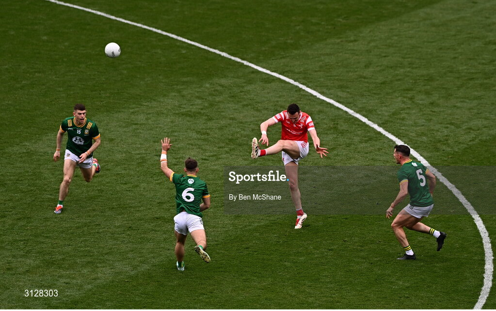 11 May 2025; Tommy Durnin of Louth kicks despite the attention of Meath players, from left, Eoghan Frayne, Seán Coffey and Donal Keogan during the Leinster GAA Football Senior Championship final match between Louth and Meath at Croke Park in Dublin. Photo by Ben McShane/Sportsfile