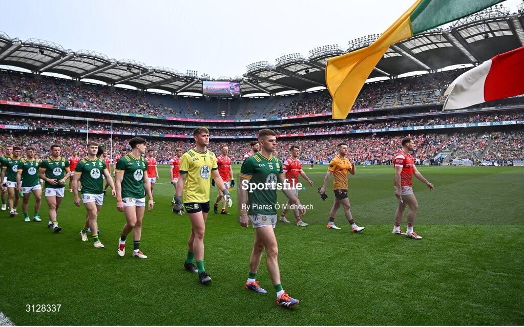 11 May 2025; Meath captain Eoghan Frayne and Louth captain Ciarán Downey lead their teams in the parade behind The Artane Band before the Leinster GAA Football Senior Championship final match between Louth and Meath at Croke Park in Dublin. Photo by Piaras Ó Mídheach/Sportsfile