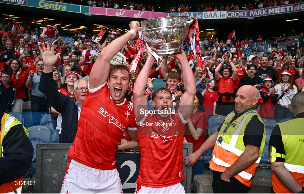 11 May 2025; Conor Grimes, left, and Ciarán Byrne of Louth celebrate with the Delaney Cup after the Leinster GAA Football Senior Championship final match between Louth and Meath at Croke Park in Dublin. Photo by Ben McShane/Sportsfile
