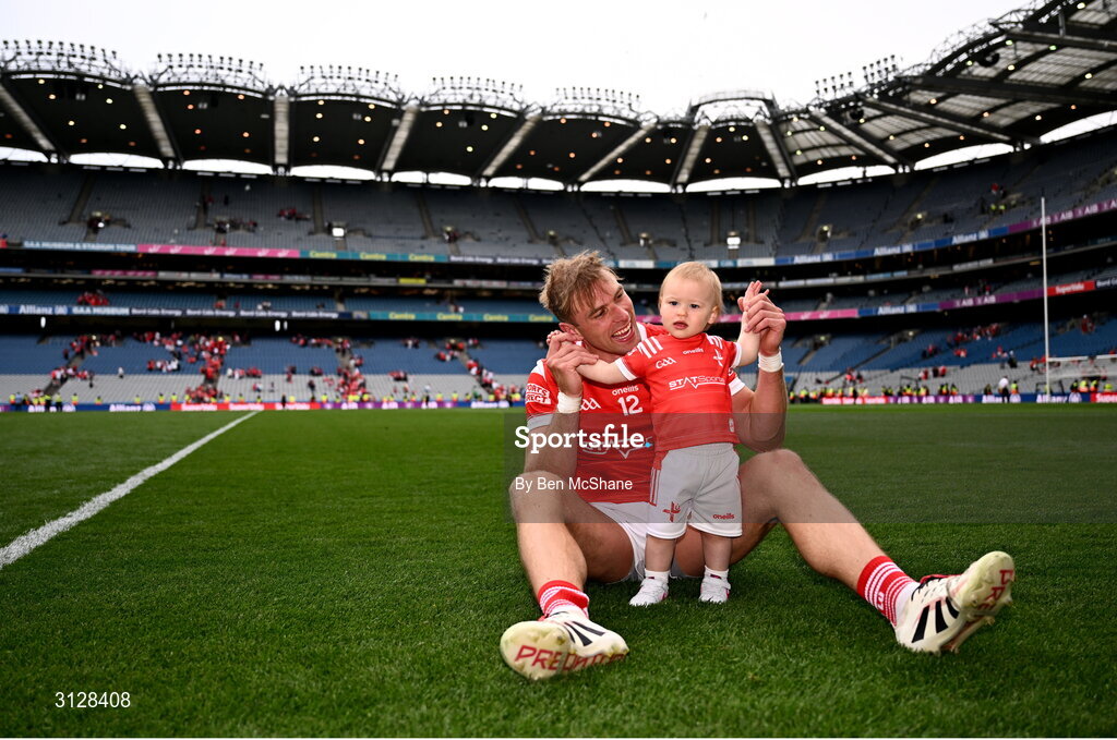 11 May 2025; Conor Grimes of Louth celebrates with his daughter Izzy, aged one, after his side's victory in the Leinster GAA Football Senior Championship final match between Louth and Meath at Croke Park in Dublin. Photo by Ben McShane/Sportsfile