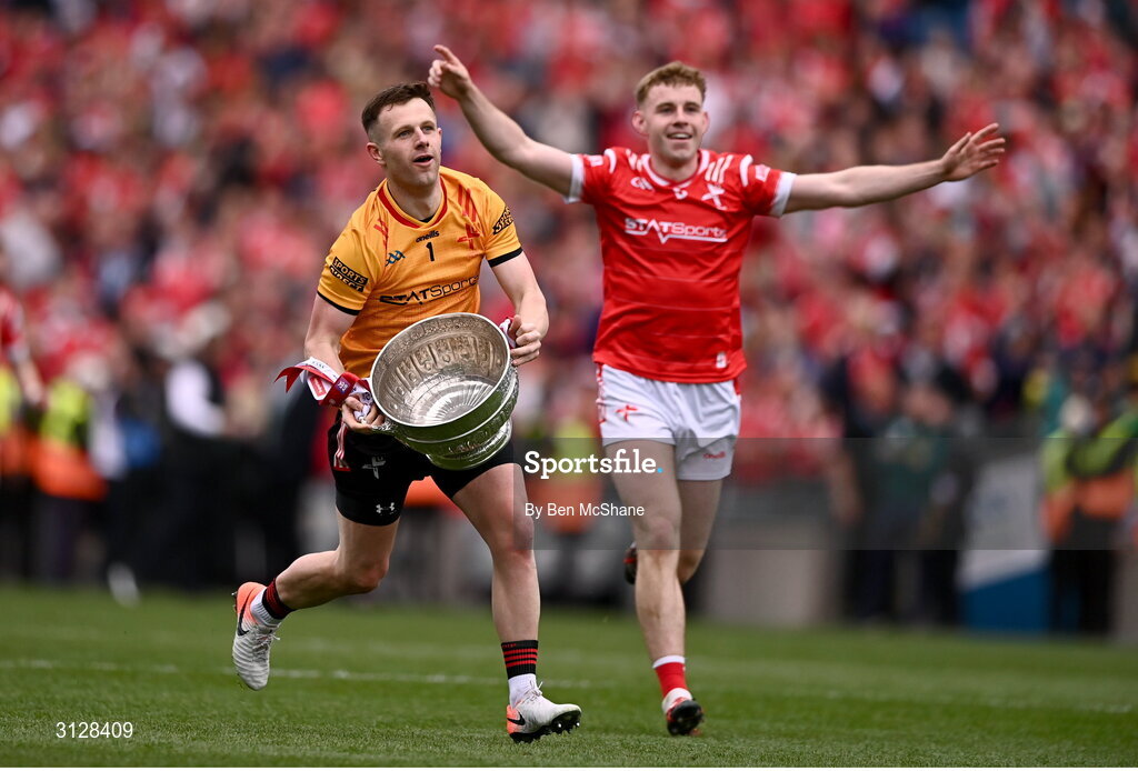 11 May 2025; Louth goalkeeper Niall McDonnell, left, and Peter Lynch of Louth bring the Delaney Cup toward the Louth supporters on Hill 16 after their side's victory in the Leinster GAA Football Senior Championship final match between Louth and Meath at Croke Park in Dublin. Photo by Ben McShane/Sportsfile