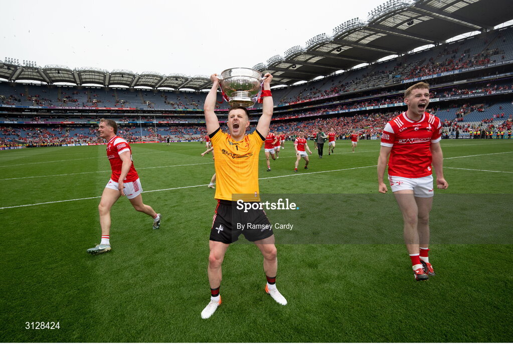 11 May 2025; Louth goalkeeper Niall McDonnell, centre, and Peter Lynch celebrate with the Delaney Cup after the Leinster GAA Football Senior Championship final match between Louth and Meath at Croke Park in Dublin. Photo by Ramsey Cardy/Sportsfile
