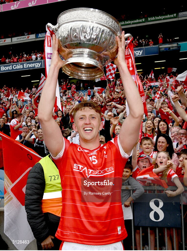 11 May 2025; Ryan Burns of Louth with the Delaney Cup after the Leinster GAA Football Senior Championship final match between Louth and Meath at Croke Park in Dublin. Photo by Ramsey Cardy/Sportsfile