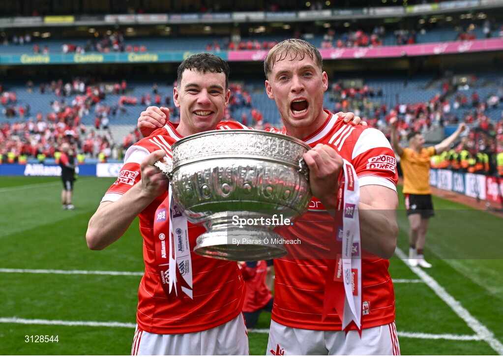 11 May 2025; Louth players Craig Lennon, left, and Ciarán Byrne celebrate with the Delaney Cup after their side's victory in the Leinster GAA Football Senior Championship final match between Louth and Meath at Croke Park in Dublin. Photo by Piaras Ó Mídheach/Sportsfile