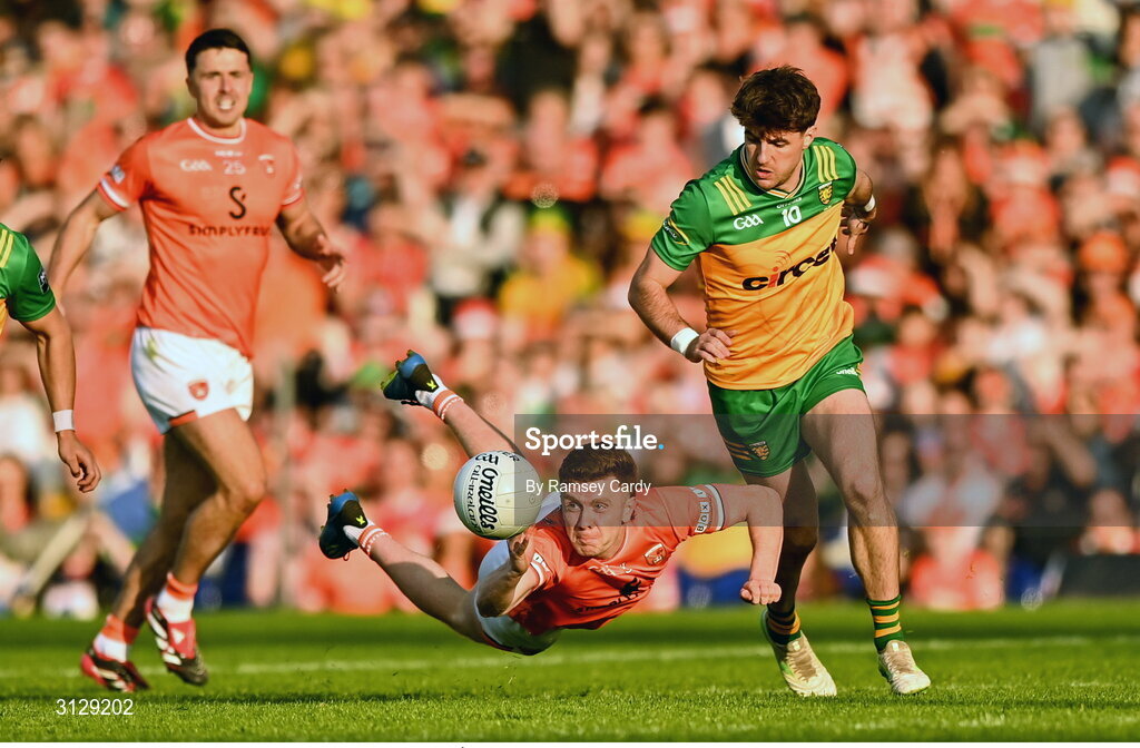 10 May 2025; Ross McQuillan of Armagh in action against Dáire Ó Baoill of Donegal during the Ulster GAA Football Senior Championship final match between Armagh and Donegal at St Tiernach's Park in Clones, Monaghan. Photo by Ramsey Cardy/Sportsfile