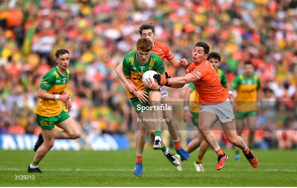 10 May 2025; Ciaran Moore of Donegal in action against Andrew Murnin, left, and Paddy Burns of Armagh during the Ulster GAA Football Senior Championship final match between Armagh and Donegal at St Tiernach's Park in Clones, Monaghan. Photo by Ramsey Cardy/Sportsfile
