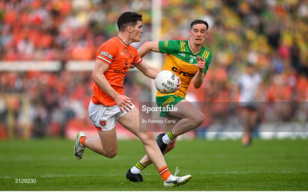 10 May 2025; Jarly Óg Burns of Armagh in action against Ciaran Thompson of Donegal during the Ulster GAA Football Senior Championship final match between Armagh and Donegal at St Tiernach's Park in Clones, Monaghan. Photo by Ramsey Cardy/Sportsfile