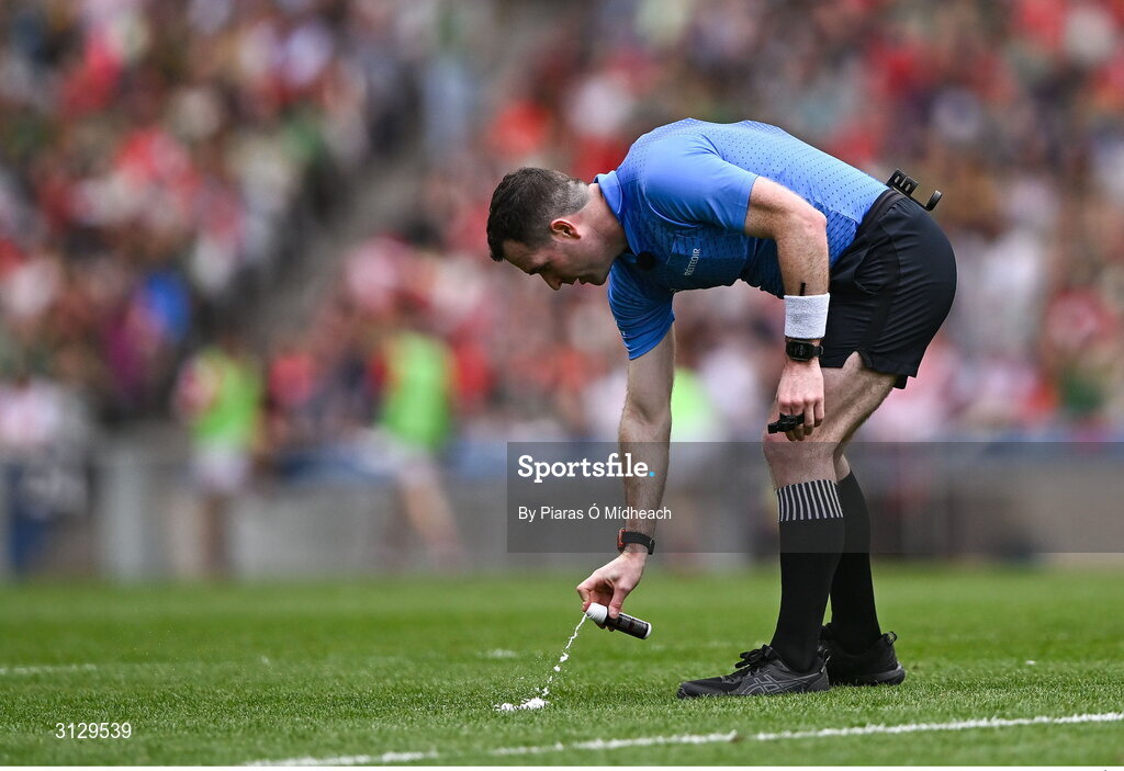11 May 2025; Referee Martin McNally using vanishing spray to mark the position of a free during the Leinster GAA Football Senior Championship final match between Louth and Meath at Croke Park in Dublin. Photo by Piaras Ó Mídheach/Sportsfile