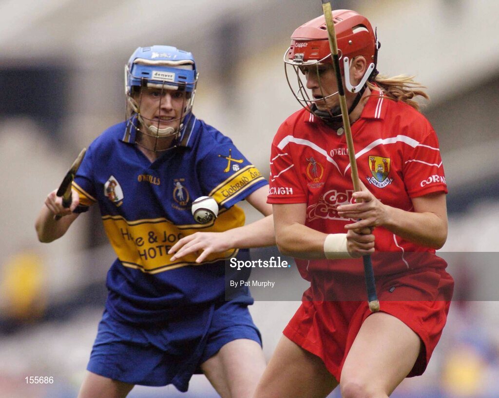 19 September 2004; Mary O'Connor, Cork, in action against Noelle Kennedy, Tipperary. Foras na Gaeilge Senior Camogie Championship All-Ireland Final, Tipperary v Cork, Croke Park, Dublin. Picture credit; Pat Murphy / SPORTSFILE