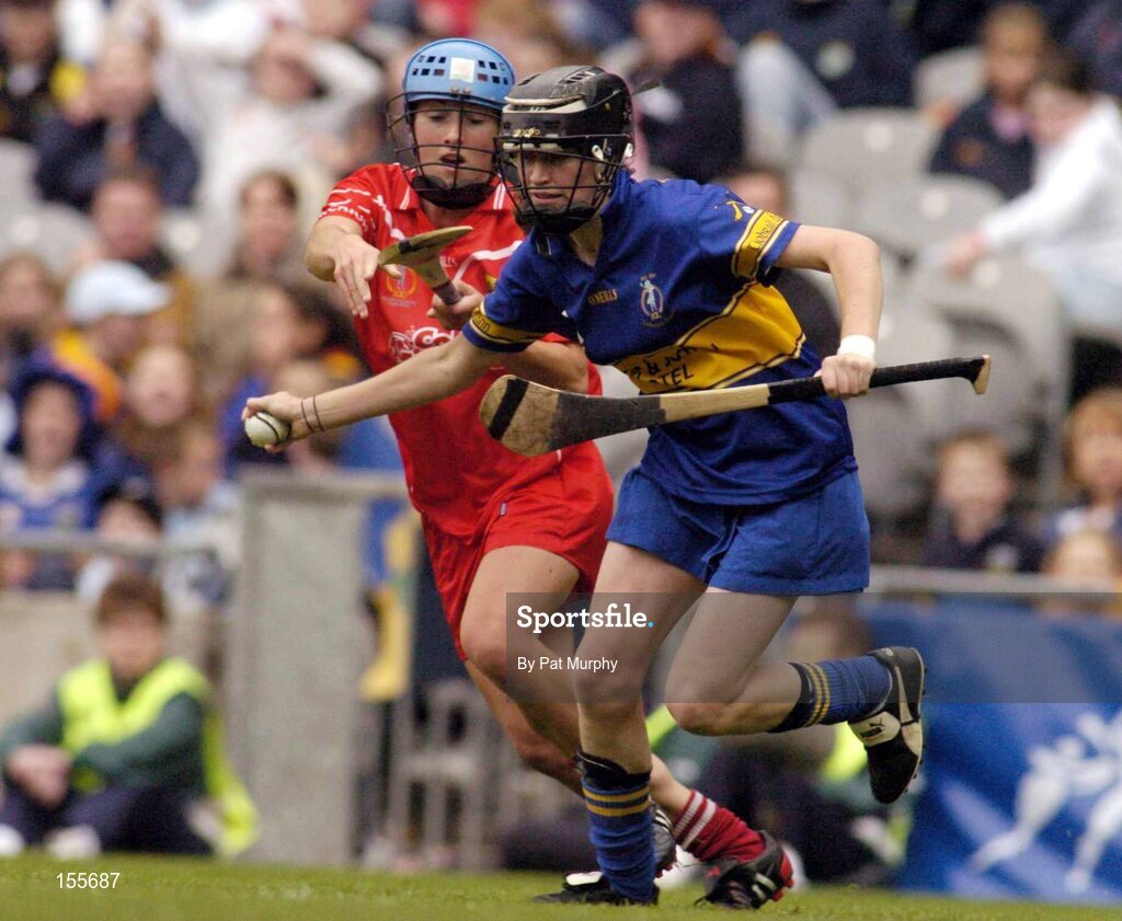 19 September 2004; Siobhan Kelly, Tipperary, in action against Jennifer O'Leary, Cork. Foras na Gaeilge Senior Camogie Championship All-Ireland Final, Tipperary v Cork, Croke Park, Dublin. Picture credit; Pat Murphy / SPORTSFILE