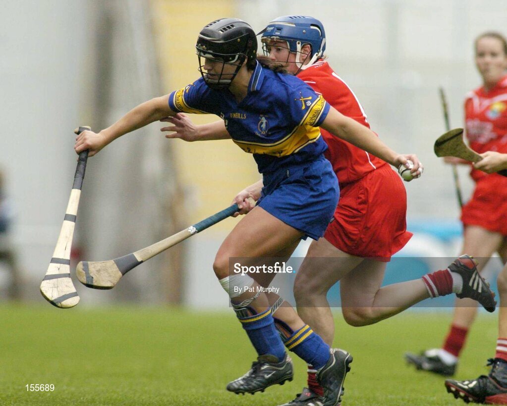19 September 2004; Ciara Gaynor, Tipperary, in action against Joanne Ryan, Cork. Foras na Gaeilge Senior Camogie Championship All-Ireland Final, Tipperary v Cork, Croke Park, Dublin. Picture credit; Pat Murphy / SPORTSFILE