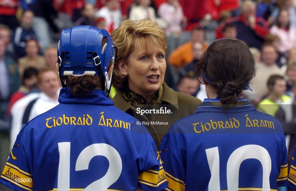 19 September 2004; President Mary McAleese is introduced to Tipperary players Noelle Kennedy, 10, and Claire Grogan before the start of the game Foras na Gaeilge Senior Camogie Championship All-Ireland Final, Tipperary v Cork, Croke Park, Dublin. Picture credit; Ray McManus / SPORTSFILE