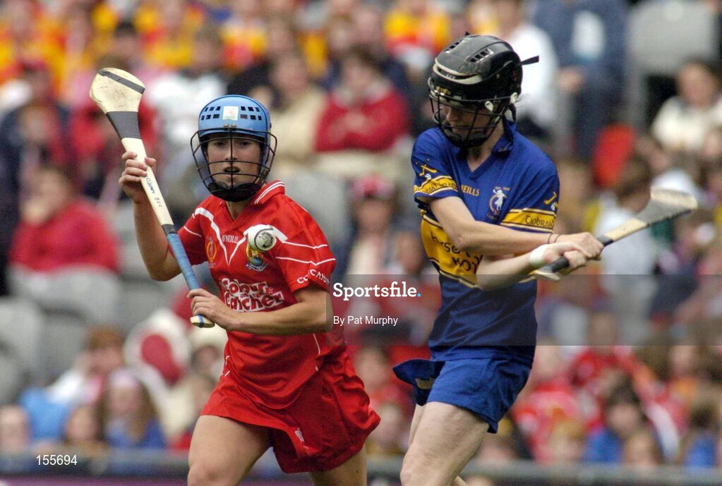 19 September 2004; Suzanne Kelly, Tipperary, in action against Jennifer O'Leary, Cork. Foras na Gaeilge Senior Camogie Championship All-Ireland Final, Tipperary v Cork, Croke Park, Dublin. Picture credit; Pat Murphy / SPORTSFILE