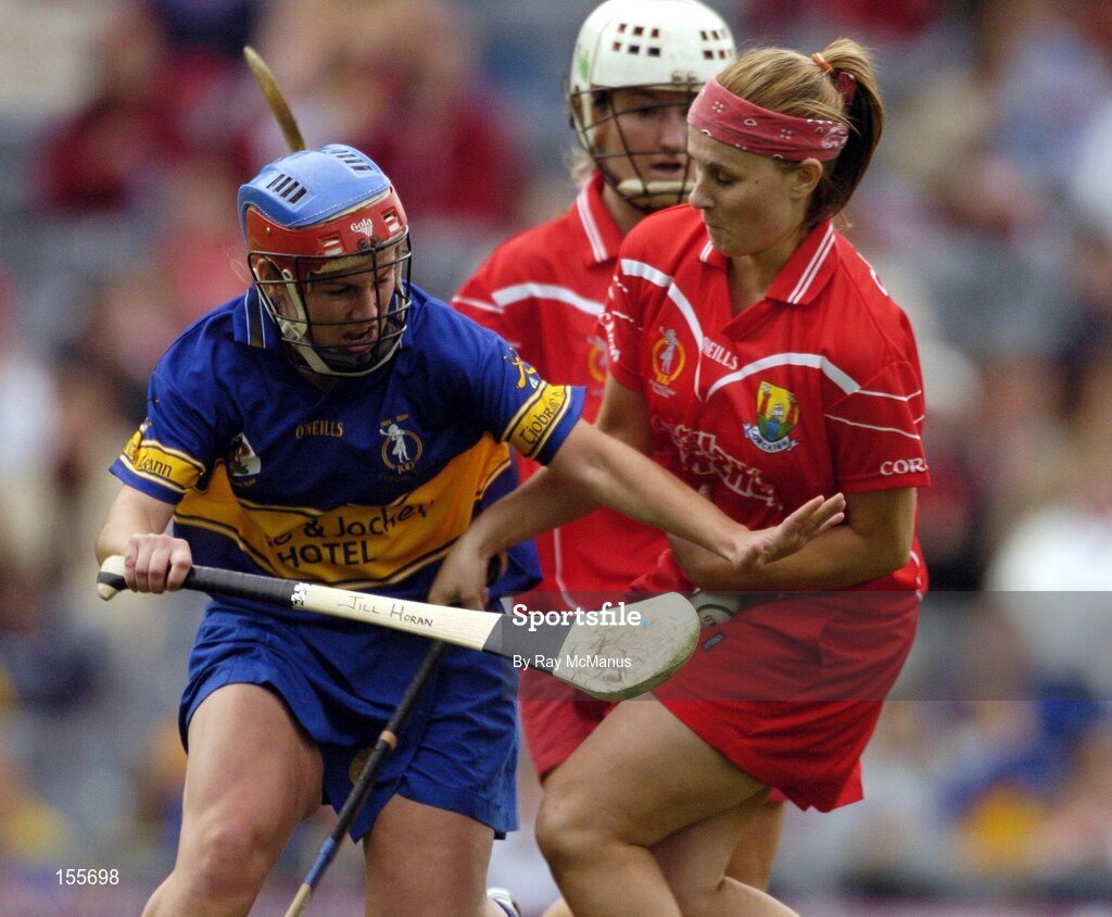 19 September 2004; Cork 'keeper Aoife Murray, supported by Joanne O'Callaghan, is tackled by Tipperary corner forward Jill Horan. Foras na Gaeilge Senior Camogie Championship All-Ireland Final, Tipperary v Cork, Croke Park, Dublin. Picture credit; Ray McManus / SPORTSFILE
