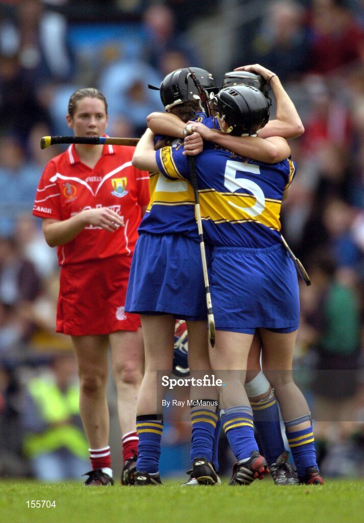 19 September 2004; Tipperary defenders Sinead Nealon, 5, Suzanne Kelly, 2, and Ciara Gaynor celebrate victory. Foras na Gaeilge Senior Camogie Championship All-Ireland Final, Tipperary v Cork, Croke Park, Dublin. Picture credit; Ray McManus / SPORTSFILE
