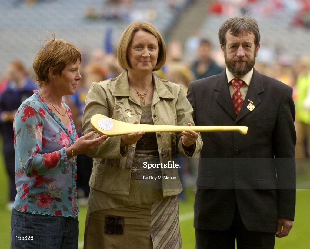 19 September 2004; President of the Camogie Association Miriam O'Callaghan with Sean Kelly, President of the GAA, holds the Golden Hurley, in honour of the Camogie Centenary. Foras na Gaeilge Senior Camogie Championship All-Ireland Final, Tipperary v Cork, Croke Park, Dublin. Picture credit; Ray McManus / SPORTSFILE