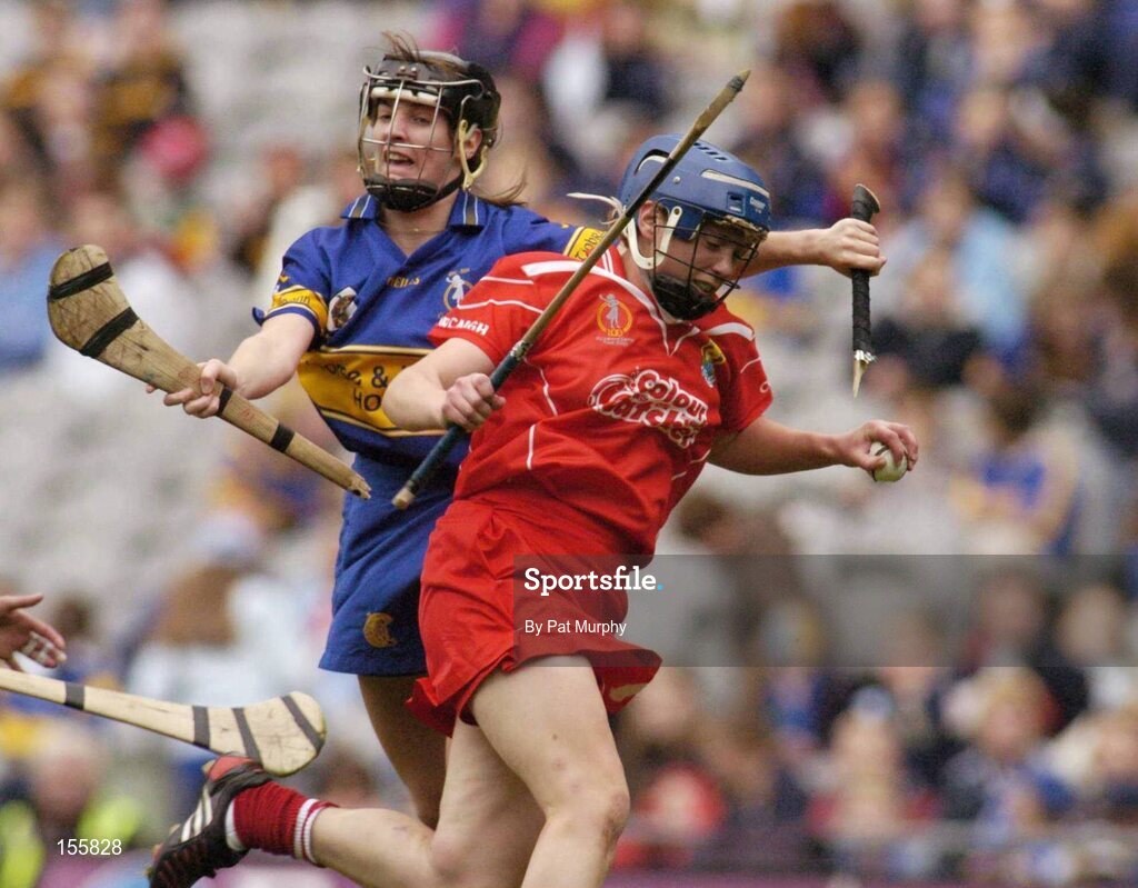 19 September 2004; Emer Dillon, Cork, in action against Sinead Nealon, Tipperary. Foras na Gaeilge Senior Camogie Championship All-Ireland Final, Tipperary v Cork, Croke Park, Dublin. Picture credit; Pat Murphy / SPORTSFILE