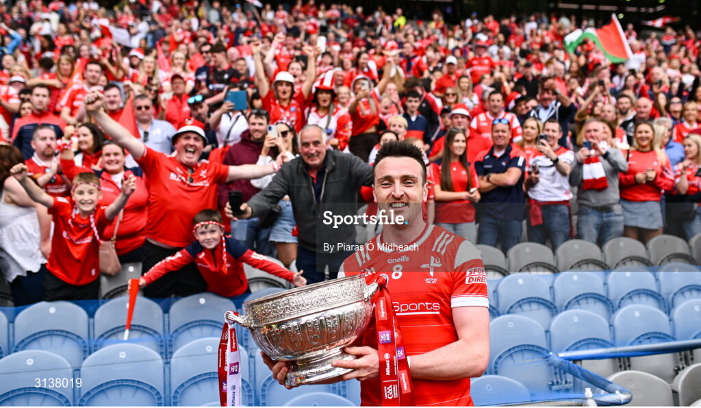 11 May 2025; Tommy Durnin of Louth holds the Delaney Cup for a picture in front of the Louth supporters in the Hogan Stand after their side's victory in the Leinster GAA Football Senior Championship final match between Louth and Meath at Croke Park in Dublin. Photo by Piaras Ó Mídheach/Sportsfile
