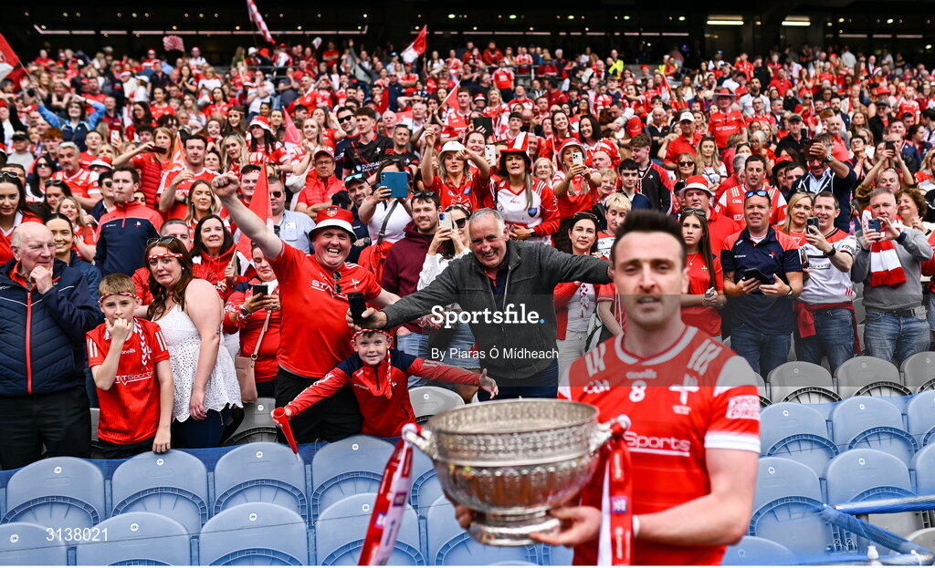 11 May 2025; Louth supporters look on from the Hogan Stand as Tommy Durnin of Louth holds the Delaney Cup after their side's victory in the Leinster GAA Football Senior Championship final match between Louth and Meath at Croke Park in Dublin. Photo by Piaras Ó Mídheach/Sportsfile