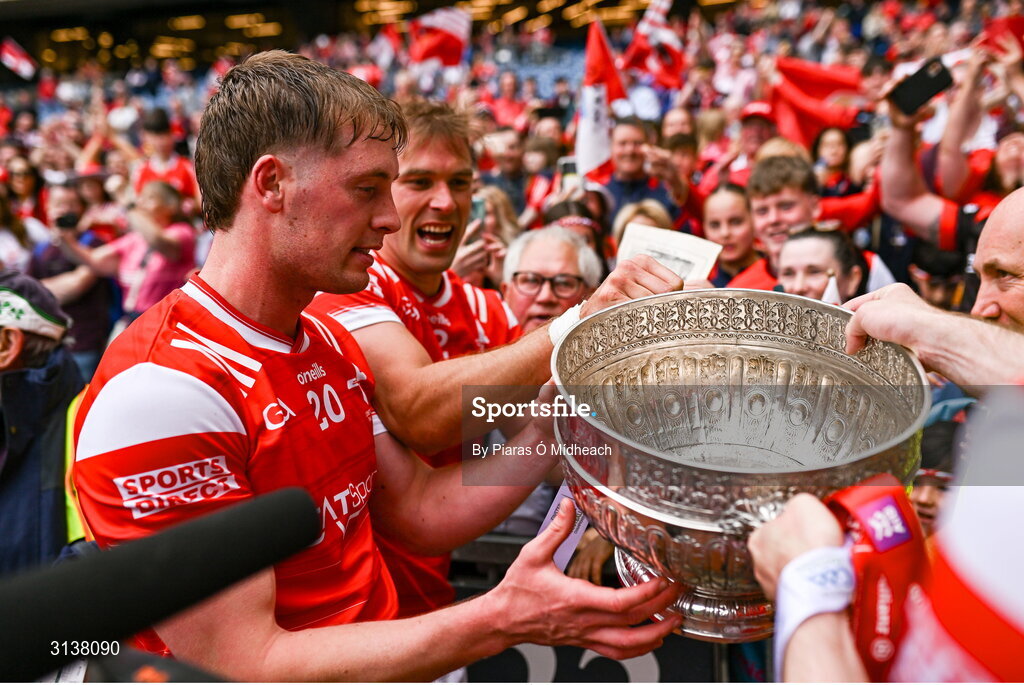 11 May 2025; Louth players Ciarán Byrne and Conor Grimes, behind, with the Delaney Cup after victory in the Leinster GAA Football Senior Championship final match between Louth and Meath at Croke Park in Dublin. Photo by Piaras Ó Mídheach/Sportsfile