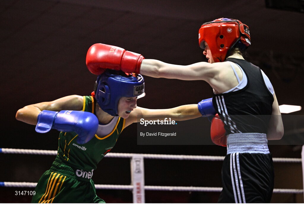 30 May 2025; Heidi Carolan of East Meath BC, right, in action against Kaiden McKenna of Castleblayney BC during their bout at the 2025 National Senior Cadet Championship Finals at the National Boxing Stadium in Dublin. Photo by David Fitzgerald/Sportsfile