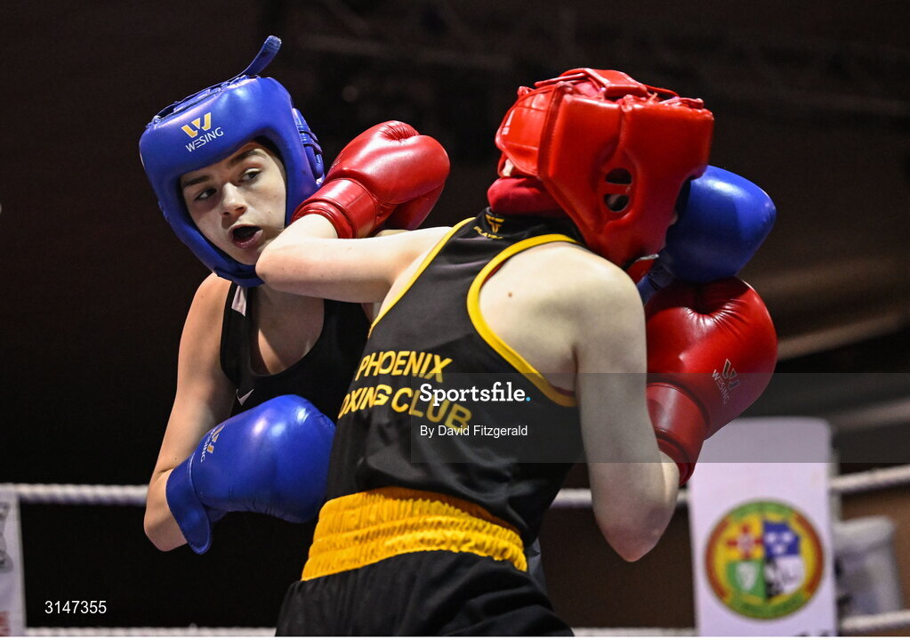 30 May 2025; Alanna Murphy of Ballybrack BC, left, in action against Lucy Prentice of Phoenix BC during their bout at the 2025 National Senior Cadet Championship Finals at the National Boxing Stadium in Dublin. Photo by David Fitzgerald/Sportsfile