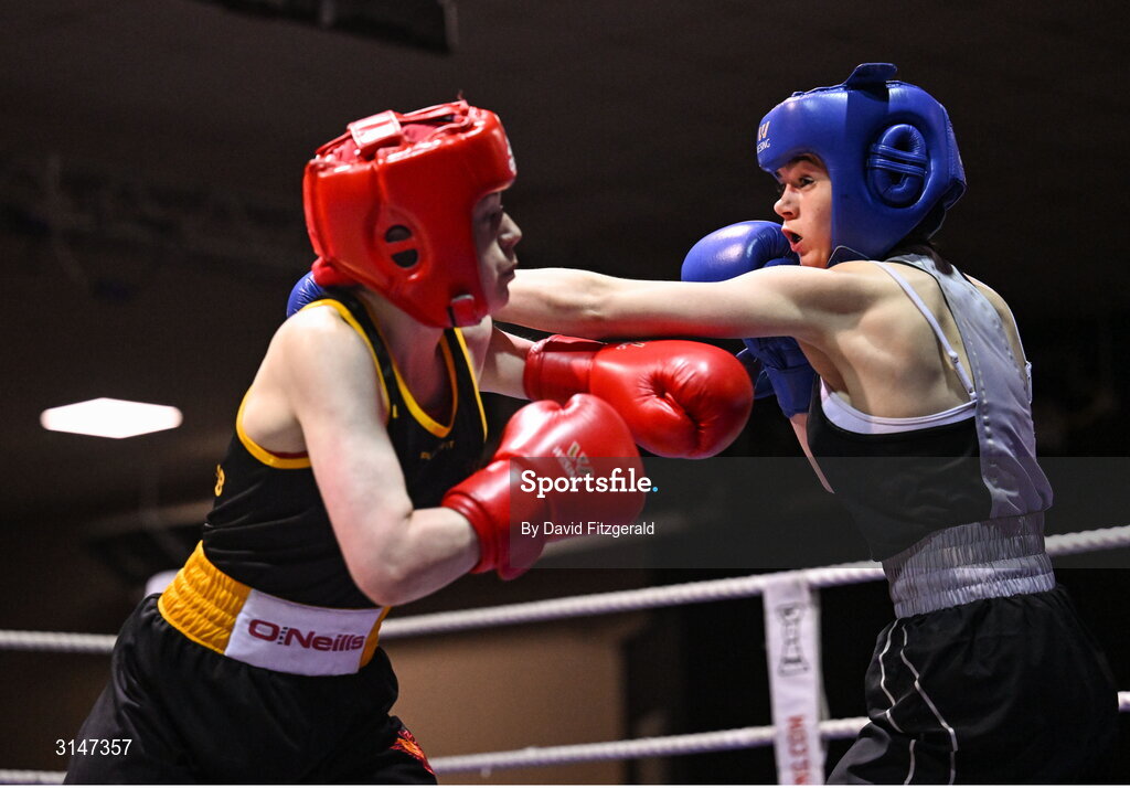 30 May 2025; Alanna Murphy of Ballybrack BC, right, in action against Lucy Prentice of Phoenix BC during their bout at the 2025 National Senior Cadet Championship Finals at the National Boxing Stadium in Dublin. Photo by David Fitzgerald/Sportsfile