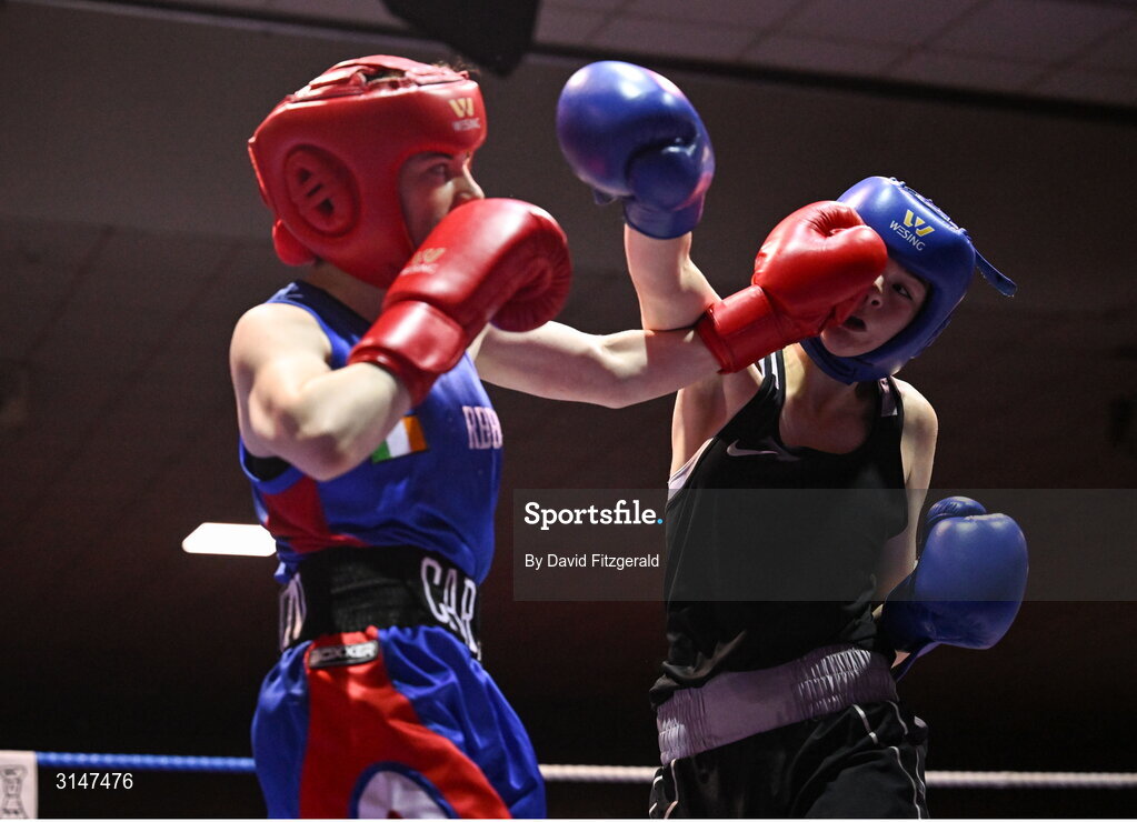 30 May 2025; Aliegha Murphy of Ballybrack BC, right, in action against Carly O’Herrin of Rochfortbridge BC during their bout at the 2025 National Senior Cadet Championship Finals at the National Boxing Stadium in Dublin. Photo by David Fitzgerald/Sportsfile