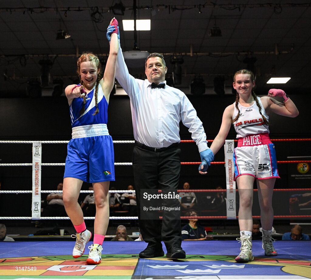 30 May 2025; Ella Archbold of Ballybrack BC, left, celebrates after winning her bout against Paige Nickels of Banbridge BC during the 2025 National Senior Cadet Championship Finals at the National Boxing Stadium in Dublin. Photo by David Fitzgerald/Sportsfile