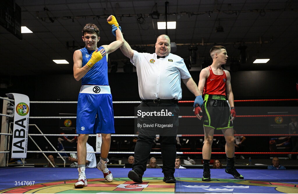 30 May 2025; Kalib Walshe of Waterford CBS, left, celebrates after winning his bout against John Nevin of Olympic G during the 2025 National Senior Cadet Championship Finals at the National Boxing Stadium in Dublin. Photo by David Fitzgerald/Sportsfile